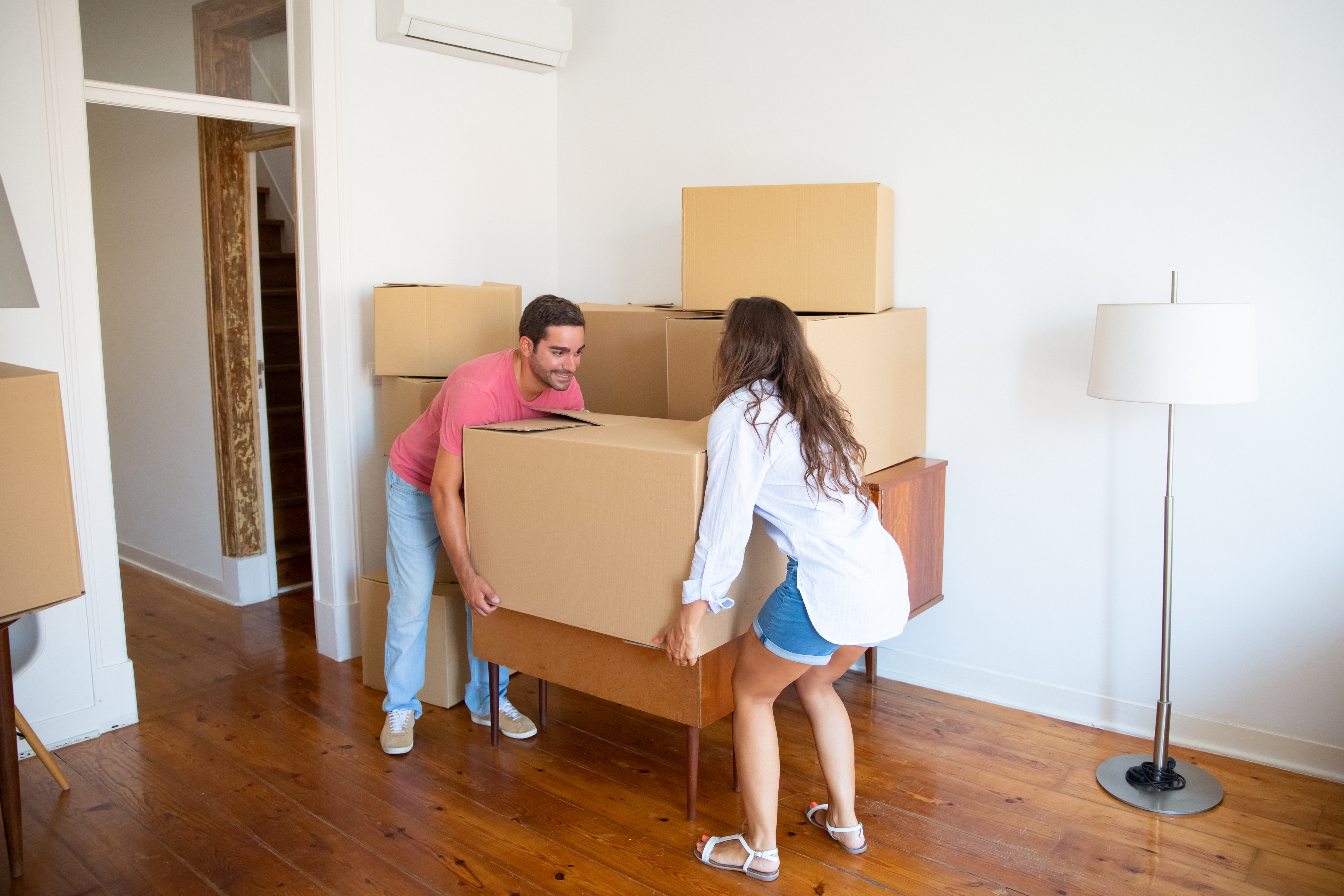 Local moving team carefully handling furniture